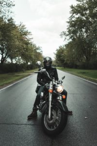 motorcyclist on the middle of the road